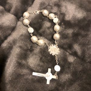 Rosary - can be used as a bracelet. I get a lot of compliments with this.  Car